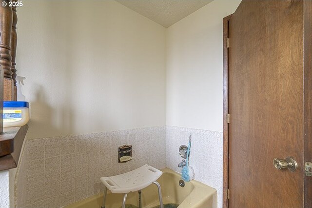 1369 34th Ave NW, Salem, OR 97304 - full bath with a bath, a wainscoted wall, and tile walls