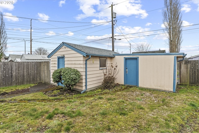 view of outbuilding featuring an outbuilding and fence