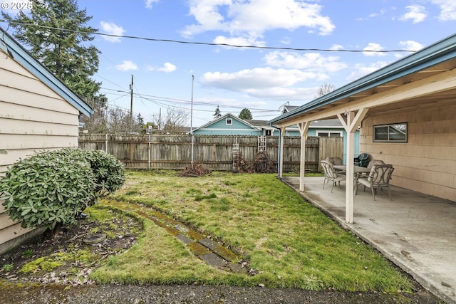 view of yard with a fenced backyard and a patio