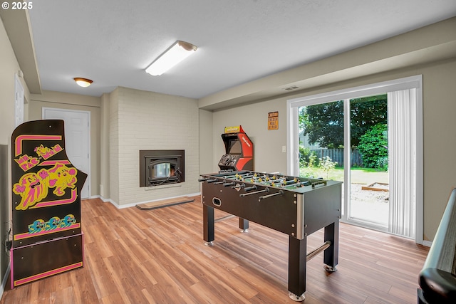4249 SE 18th Ct, Gresham, OR 97080 - game room featuring wood finished floors and a brick fireplace