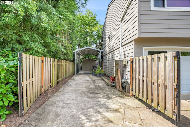 4249 SE 18th Ct, Gresham, OR 97080 - view of side of home with a carport, a storage shed, and driveway