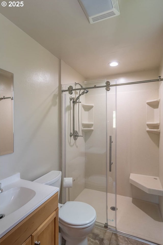 5310 Green Valley Rd, Oakland, OR 97462 - full bathroom with a shower stall, toilet, vanity, tile patterned floors, and recessed lighting