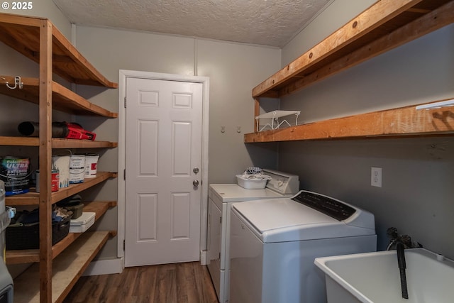 5310 Green Valley Rd, Oakland, OR 97462 - washroom with dark wood-style floors, washing machine and clothes dryer, and a textured ceiling
