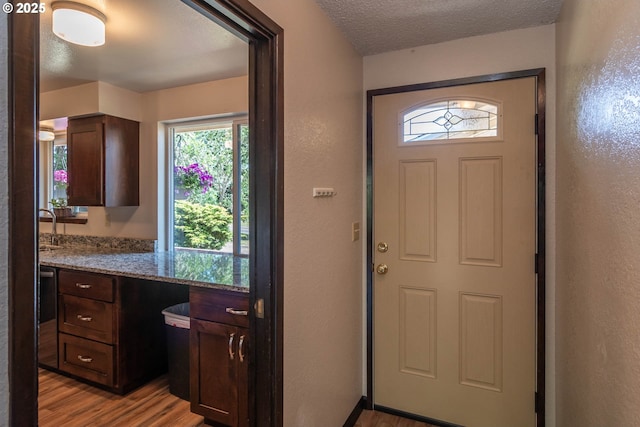 5310 Green Valley Rd, Oakland, OR 97462 - foyer entrance with light wood-style floors, a textured ceiling, and a textured wall