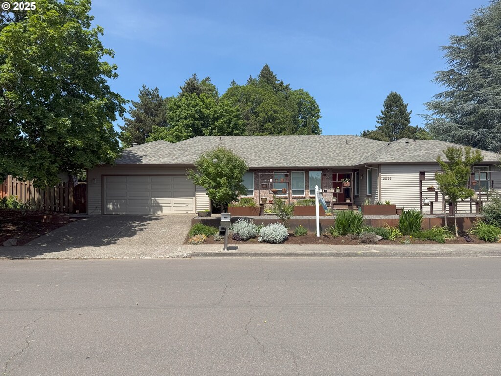 16859 NW Joscelyn St, Beaverton, OR 97006 - single story home featuring driveway, a garage, and a porch