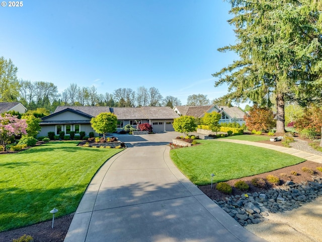 single story home featuring an attached garage, driveway, and a front yard