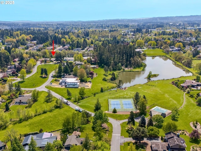 birds eye view of property with a water view