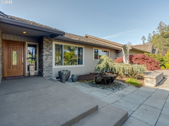 exterior space with stone siding