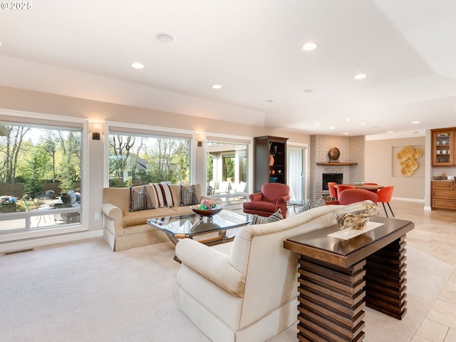 living area with recessed lighting, baseboards, visible vents, and a fireplace