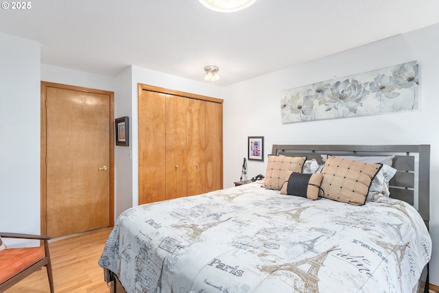 bedroom featuring light hardwood / wood-style flooring and a closet