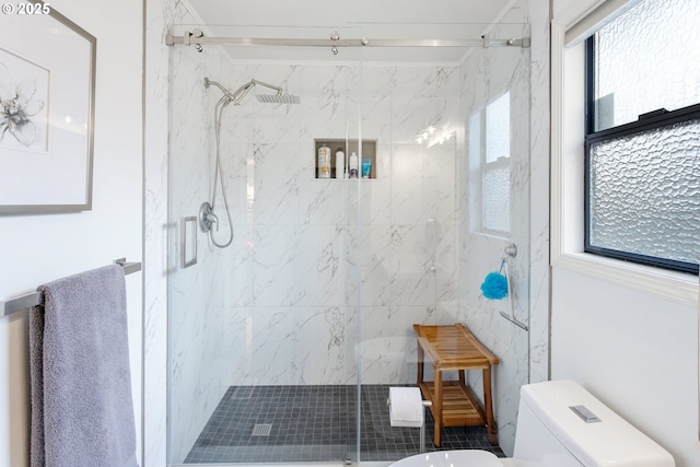 bathroom featuring toilet and walk in shower