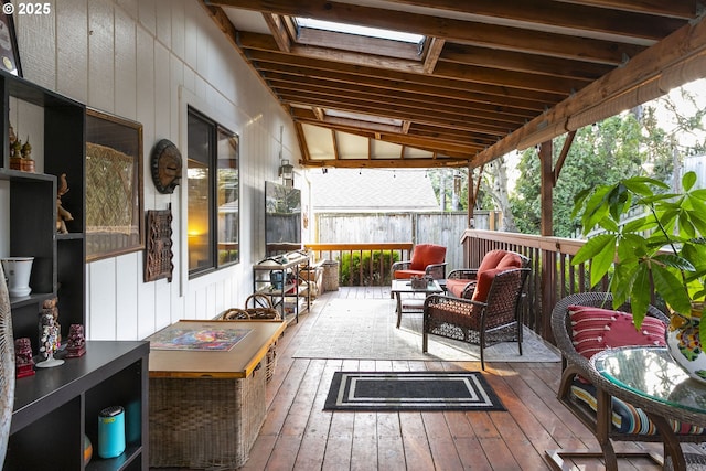 wooden terrace with an outdoor hangout area