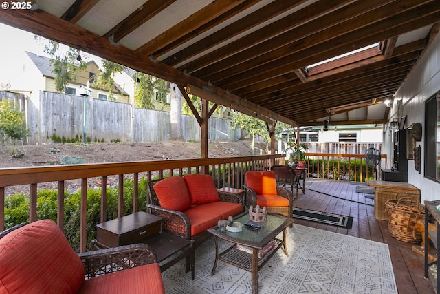 wooden deck with an outdoor living space