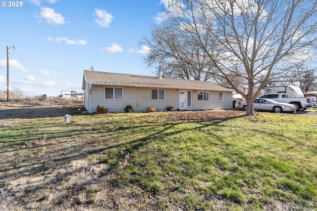 single story home featuring a front lawn