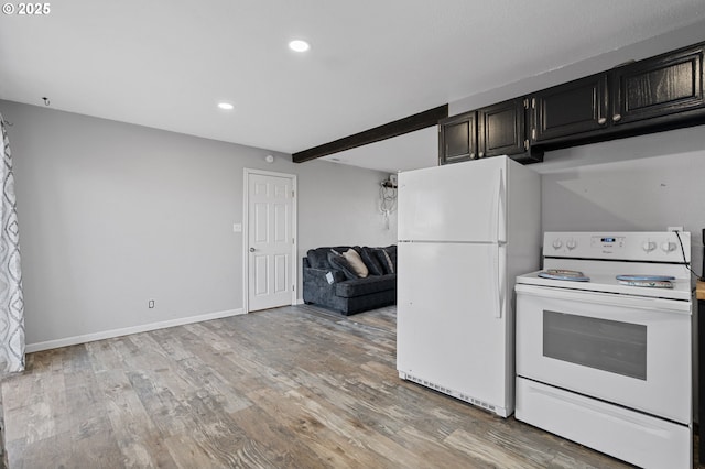 kitchen with light wood-type flooring, beamed ceiling, and white appliances