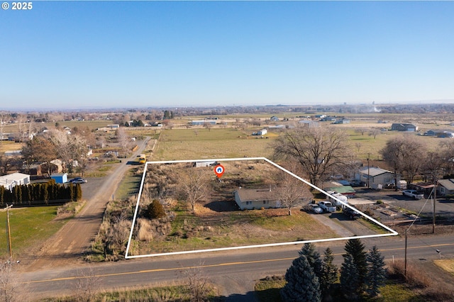 birds eye view of property featuring a rural view