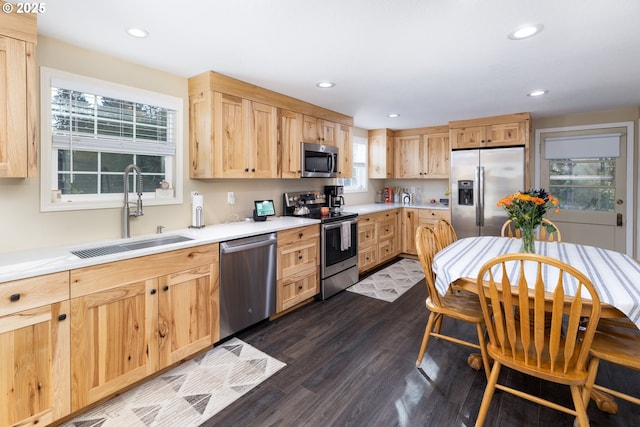 kitchen with light brown cabinets, recessed lighting, stainless steel appliances, dark wood-style flooring, and a sink