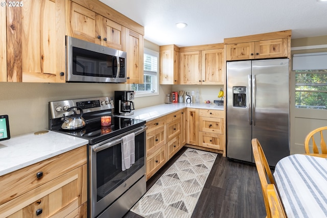 kitchen featuring recessed lighting, appliances with stainless steel finishes, dark wood finished floors, and light brown cabinetry