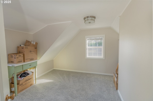 bonus room featuring carpet flooring, vaulted ceiling, and baseboards