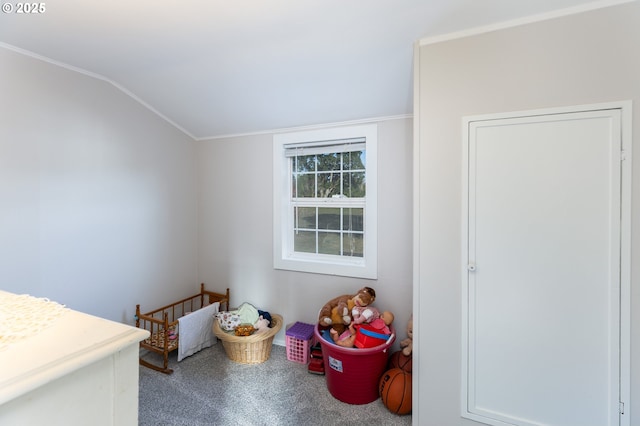 carpeted bedroom featuring lofted ceiling and ornamental molding