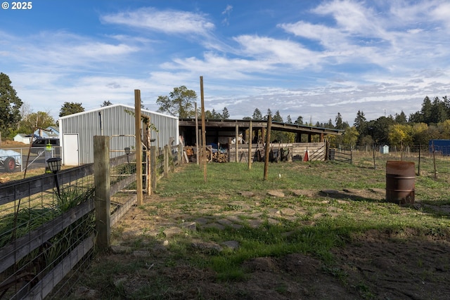 view of yard with an outdoor structure and an exterior structure