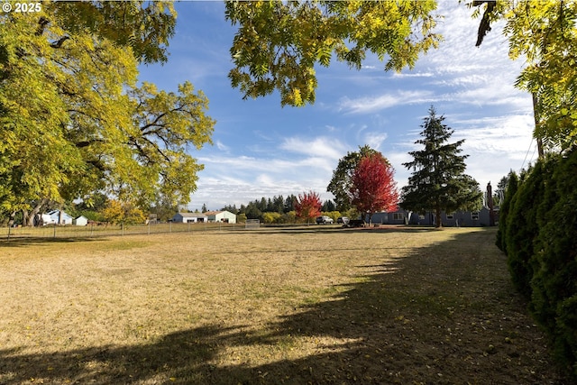 view of property's community with a lawn