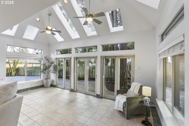 sunroom / solarium with lofted ceiling with skylight and ceiling fan