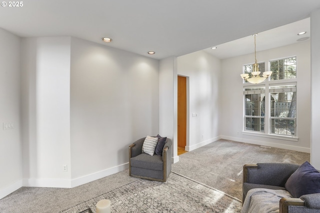 sitting room featuring a chandelier, recessed lighting, carpet flooring, and baseboards