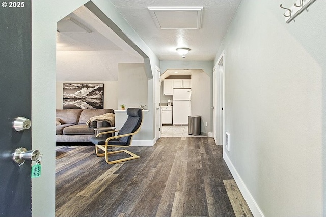 13616 SE Rhine St, Portland, OR 97236 - corridor featuring attic access, wood finished floors, and baseboards