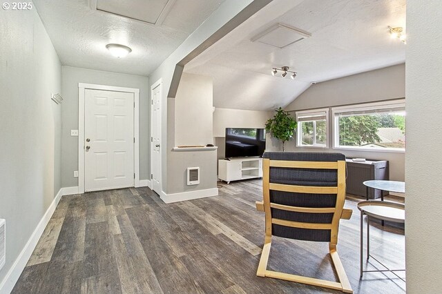 13616 SE Rhine St, Portland, OR 97236 - foyer with wood finished floors, baseboards, a textured ceiling, vaulted ceiling, and heating unit