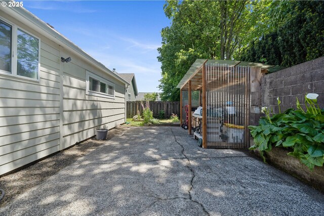 view of patio with fence