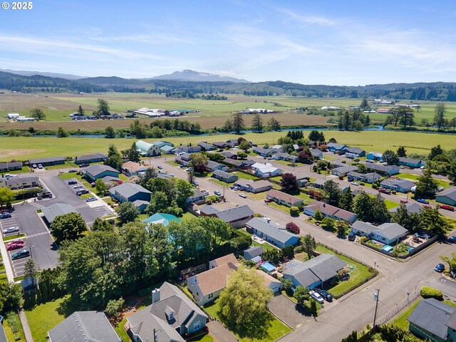 aerial view featuring a residential view, a mountain view, and a rural view
