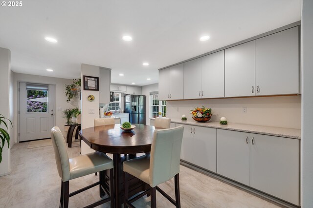 dining space featuring recessed lighting