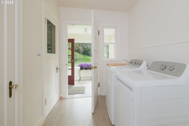 92216 Whiskey Rd, Warrenton, OR 97146 - washroom featuring washing machine and clothes dryer and baseboards
