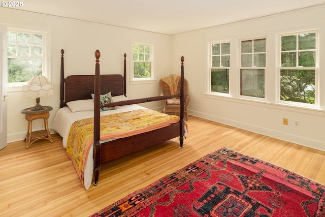 92216 Whiskey Rd, Warrenton, OR 97146 - bedroom with light wood-style floors and baseboards