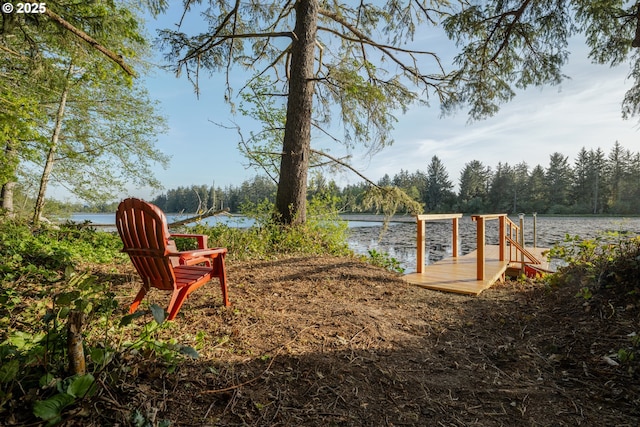 92216 Whiskey Rd, Warrenton, OR 97146 - view of yard featuring a water view, a dock, and a wooded view