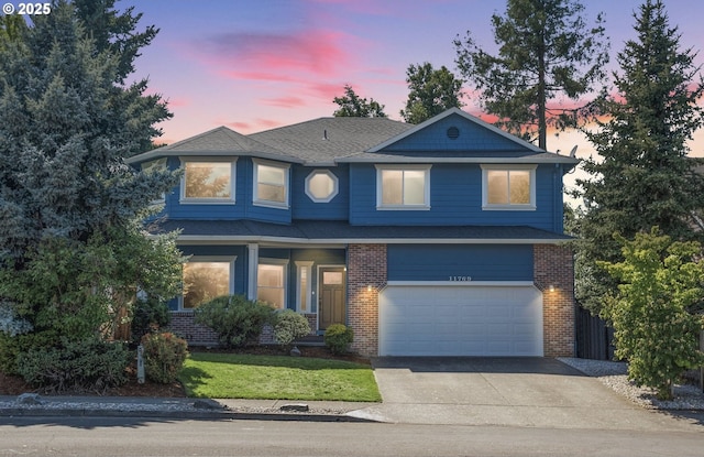 11769 SW 129th Pl, Tigard, OR 97223 - view of front of property with an attached garage, brick siding, driveway, roof with shingles, and a yard