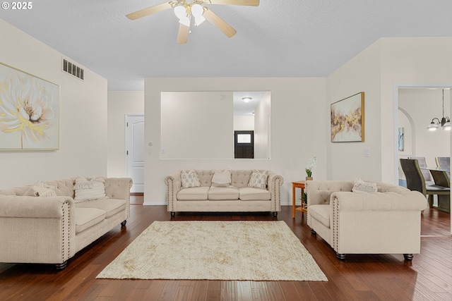 11769 SW 129th Pl, Tigard, OR 97223 - living room with a ceiling fan, dark wood-style floors, and a textured ceiling