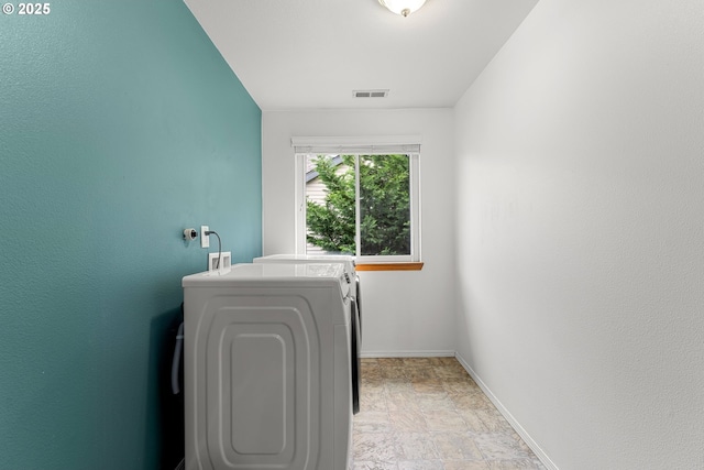 11769 SW 129th Pl, Tigard, OR 97223 - washroom with stone finish flooring, independent washer and dryer, and baseboards
