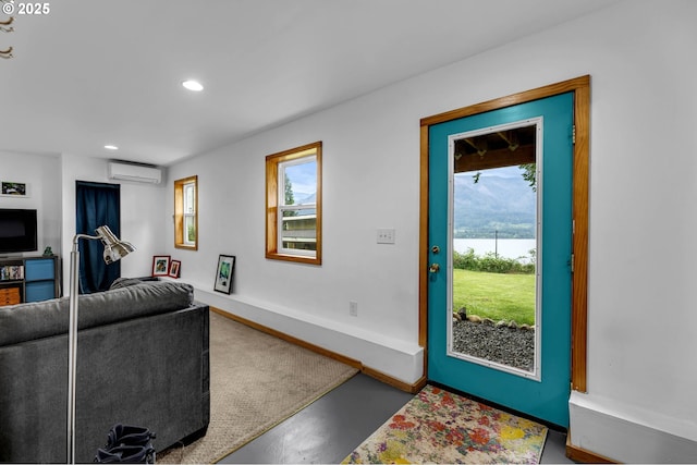 154 NE Tari Ln, Stevenson, WA 98648 - living room featuring a wall mounted AC, a water view, recessed lighting, and baseboards