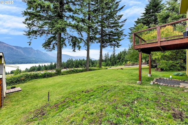 154 NE Tari Ln, Stevenson, WA 98648 - view of grassy yard with a deck with water view