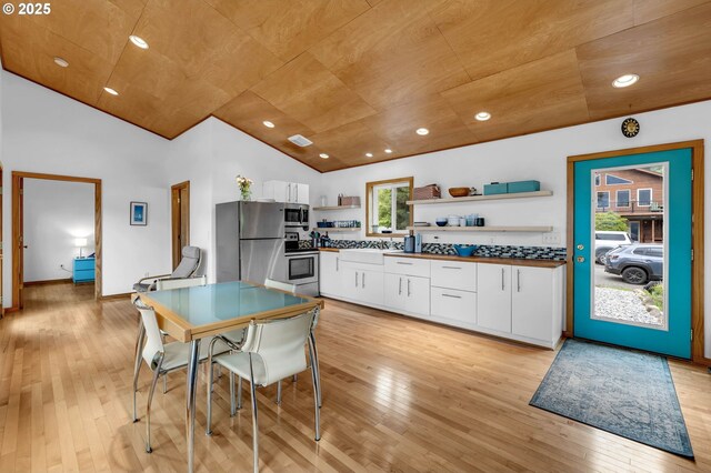154 NE Tari Ln, Stevenson, WA 98648 - kitchen featuring open shelves, vaulted ceiling, appliances with stainless steel finishes, wood ceiling, and light wood finished floors