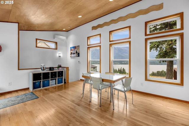 154 NE Tari Ln, Stevenson, WA 98648 - dining room with an AC wall unit, light wood-style flooring, baseboards, a water view, and wooden ceiling