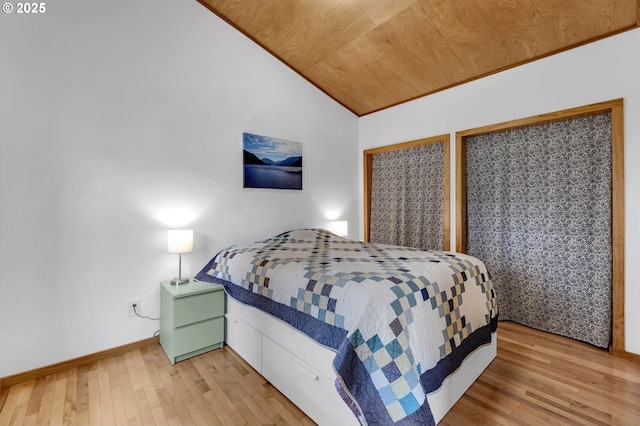 154 NE Tari Ln, Stevenson, WA 98648 - bedroom featuring light wood-style floors, vaulted ceiling, baseboards, and wooden ceiling
