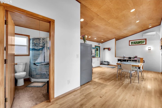 154 NE Tari Ln, Stevenson, WA 98648 - dining space featuring light wood finished floors, lofted ceiling, recessed lighting, and a wall mounted AC