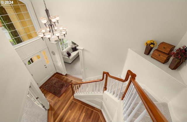 entryway with a chandelier and hardwood / wood-style flooring