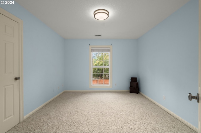 spare room featuring carpet flooring