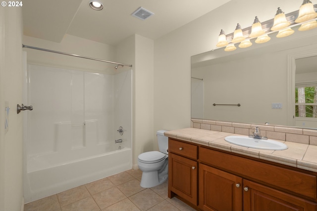 full bathroom featuring tile patterned floors, shower / washtub combination, vanity, and toilet