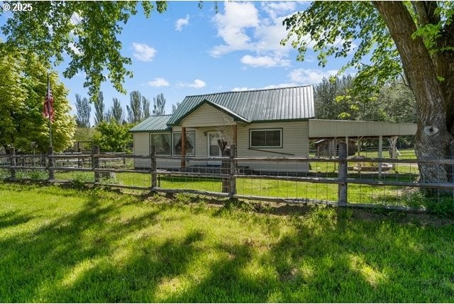 880 Heppner Spray Hwy, Heppner, OR 97836 - rear view of property featuring metal roof and a yard