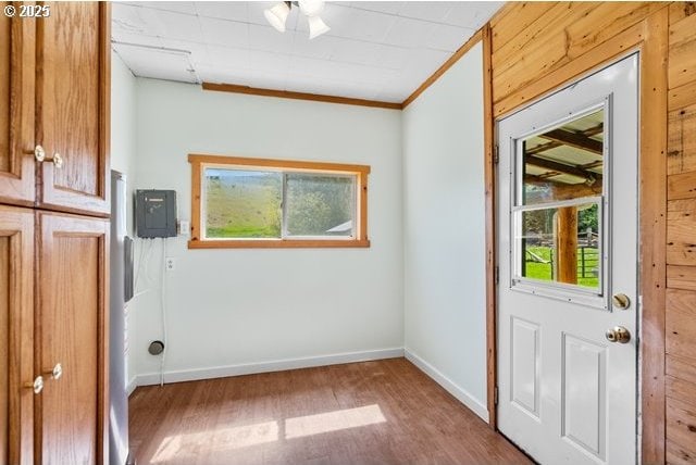 880 Heppner Spray Hwy, Heppner, OR 97836 - entryway with wood finished floors, baseboards, and crown molding